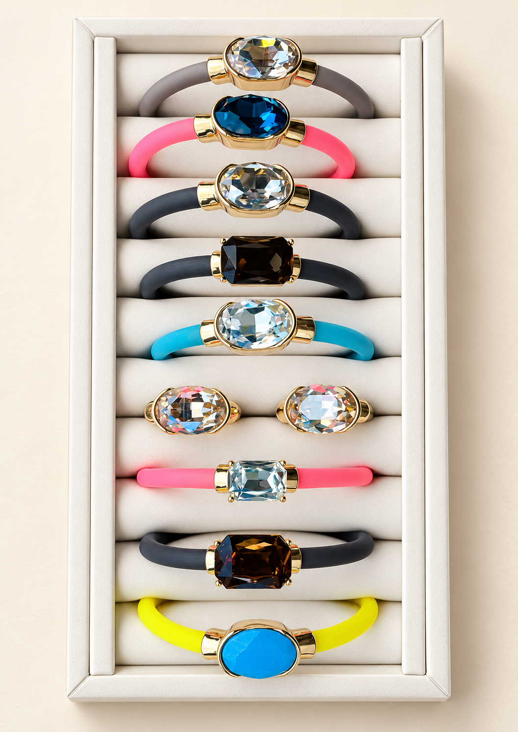 Complete colorful gemstone jewelry selection on an ivory display